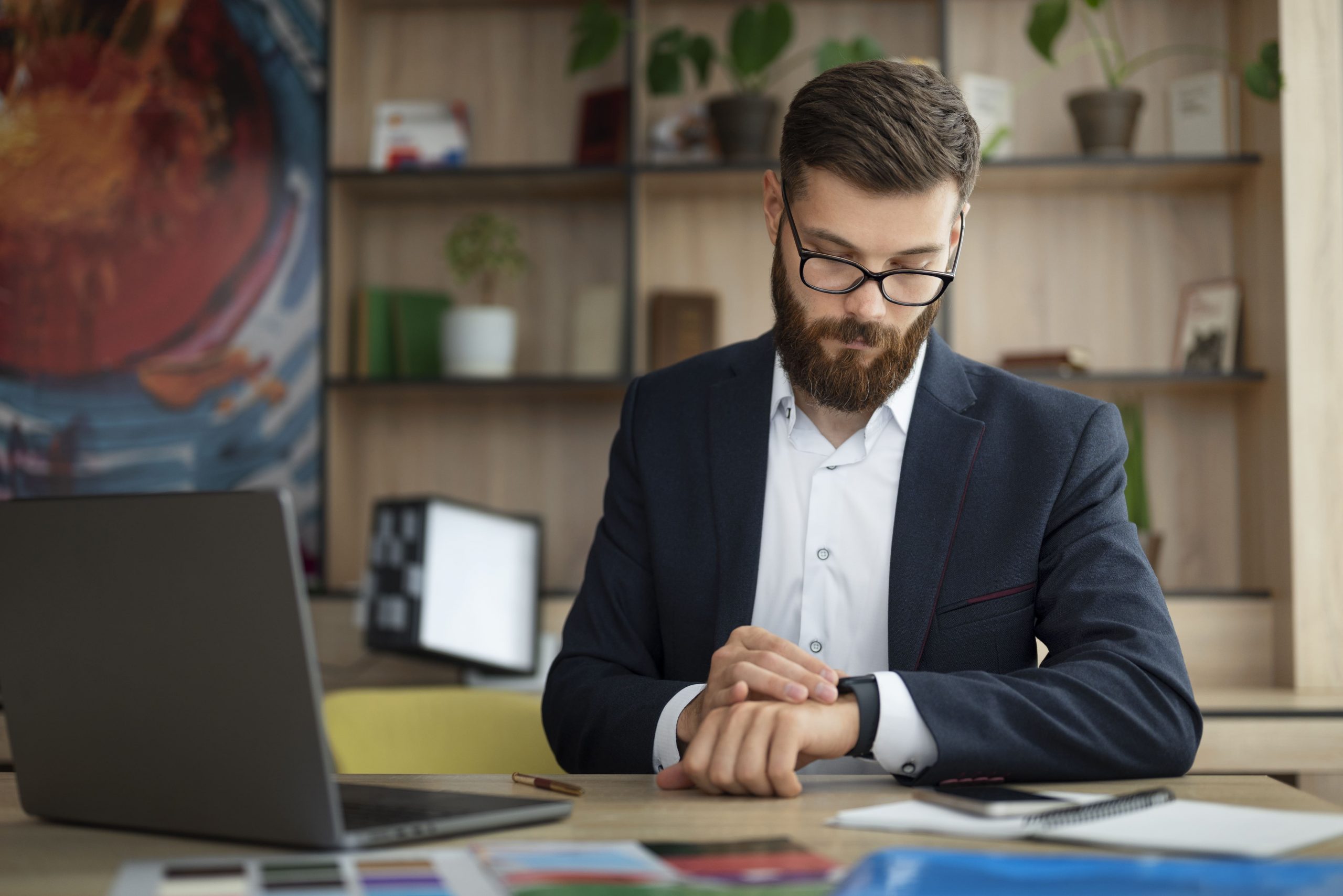 Employee working over time checking his watch