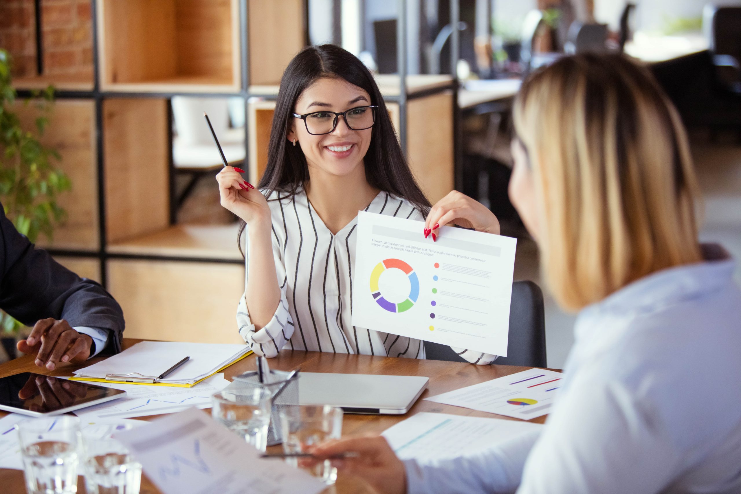 Manager discussing employee's performance review in office