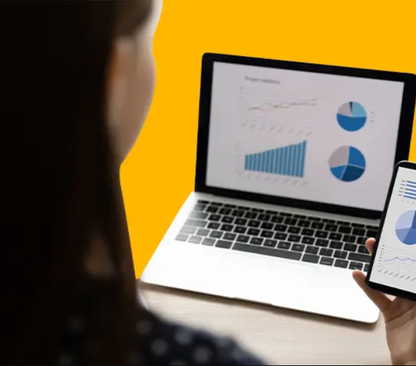 HR looking at Analytics Dashboard on Laptop and Mobile screen