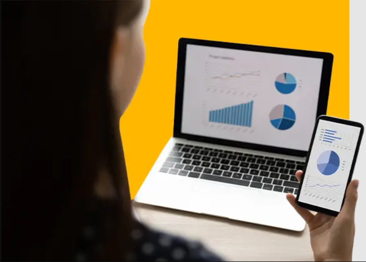 HR looking at Analytics Dashboard on Laptop and Mobile screen